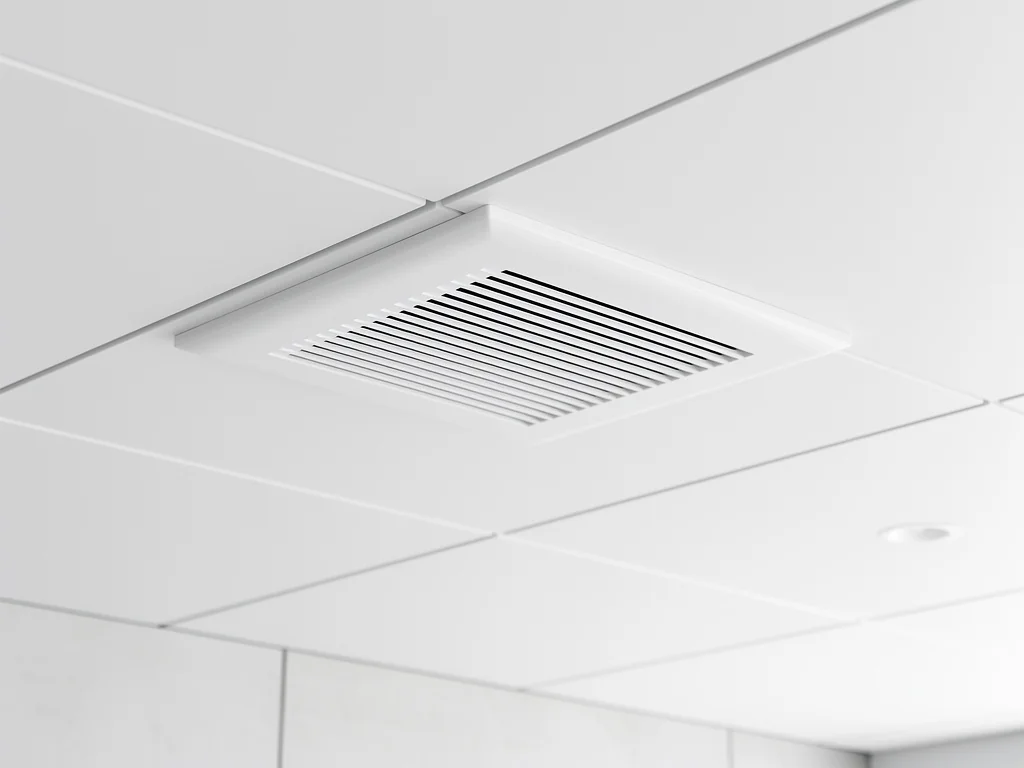 Grille de diffusion d'une climatisation gainable encastrée au plafond